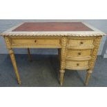An early 20th century carved and painted beech writing desk of Louis XVI design with four frieze