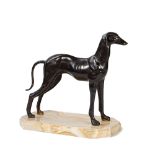 A patinated bronze model of a stylised greyhound,