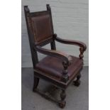 A 19th century Continental walnut open armchair with square back and beast head finials,