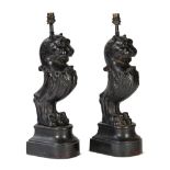 A pair of cast iron caryatid lion table lamps, 52cm high.
