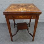 An Edwardian floral marquetry inlaid envelope card table, on tapering square supports,