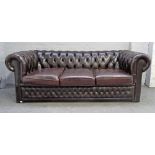 A 20th century brown leather upholstered buttonback Chesterfield sofa on block feet,