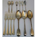 Silver table flatware, comprising; four three pronged table forks, in the 18th century taste,