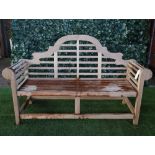 A Lutyens design teak framed hardwood garden bench, 165cm wide x 104cm high.