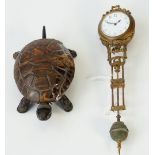 A 19th century mechanical black painted metal and tortoiseshell bell push, formed as a tortoise,