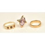A 9ct gold and garnet set three stone ring, ring size V and a half, a 9ct gold ring,