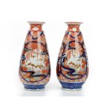 A pair of Japanese Imari vases, Meiji period, of tapered cylindrical form,