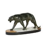 A patinated spelter sculpture of a panther, mounted on an oval onyx and black marble base, unsigned,