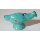 A turquoise faience bird whistle, possibly Chinese or Persian, 8cm length.