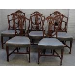 A set of eight George III mahogany shield back dining chairs,
