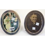 A pair of silver mounted oval strut backed photograph frames, each monogram engraved at the top,