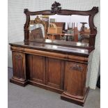 An early Victorian rosewood sideboard, with a foliate and scroll carved mirror back,