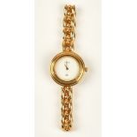 A Gucci gilt metal lady's bracelet wristwatch, the signed white dial with gilt hands,