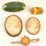 A gold mounted oval cut citrine set single stone brooch, detailed 15 CT,