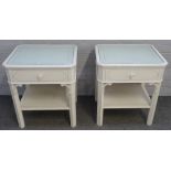 A pair of 18th century style white painted two tier occasional / bed side tables,