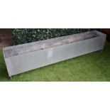 A pair of modern rectangular galvanised garden planters, each 250cm wide x 52cm high, (2).