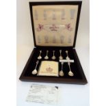 A set of ten silver and enamelled spoons, detailed within the lid of the fitted case,