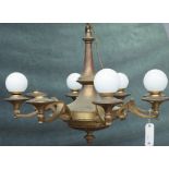 An Empire style brass eight light chandelier, 80cm wide x 62cm high.