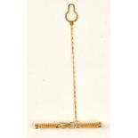 A gold tie slide in a ropetwist and knot design, detailed 750 CARNIANI, with a safety chain,