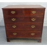 An 18th century oak chest of two short over three long graduated drawers, on bracket feet,