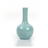 A Chinese porcelain bottle vase, 20th century, covered in a pale blue glaze, 25cm high.