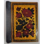 A pair of Qajar lacquer book boards, 19th century, painted with red flowers on a gold ground,