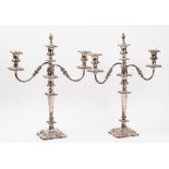 A pair of plated on copper three light table candelabra, with scrolling arms,
