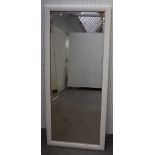 A pair of large rectangular bevelled mirror plates within white painted frames,