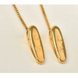 A gold box link chain fitted with an oval clip at each end, detailed 585,