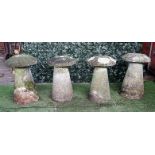 A set of four staddle stones with tapering conical bodies and mushroom tops, each approx 70cm high,