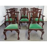 A set of eight 18th century style hardwood Chippendale revival dining chairs on claw and ball feet,