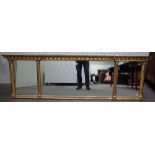 A Regency style gilt framed overmantel mirror with inverted ball mounted frieze,