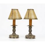 A pair of European table lamps, each with lobed and fluted decoration,