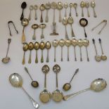 A group of silver flatware, comprising; two pairs of sugar tongs, a pair of preserve spoons,