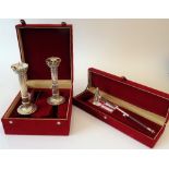 A pair of Frazer & Haws Sterling silver pricket candlesticks, each with a fluted column,