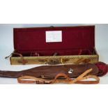 A leather bound canvas shotgun travelling case, 77cm wide, a leg of mutton canvas case,