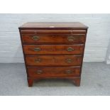 A George III mahogany chest, the brushing slide over four long graduated drawers, on bracket feet,