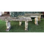 Three reconstituted stone garden benches, each on opposing beast moulded trestle end standards,