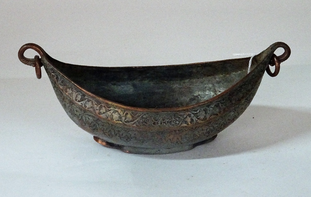 A Safavid tinned copper kachkol, possibly 18th century, of boat shape with ring handles,