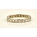 A platinum and diamond set full eternity ring mounted with circular cut diamonds,