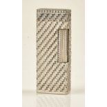 A white gold cased and diamond set rectangular gas lighter,