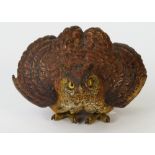 An Austrian cold painted bronze model of an owl posed in a defensive position, unsigned, 9cm high.