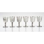 A set of six silver wine goblets, each raised on a circular foot, below a turned stem, height 12.
