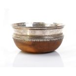 A silver mounted hardwood wooden salad bowl, having a decorated rim, London 1972, diameter 29.5cm.