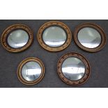 A group of five Regency style gilt framed circular convex wall mirrors, the largest, 48cm diameter,