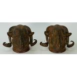 A pair of 20th century patinated bronze ram's head wall masks, 16cm high, (2).