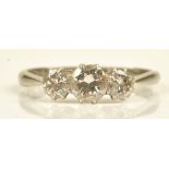 A white gold and platinum diamond set three stone ring,