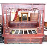 An early 20th century Chinese enclosed opium bed,