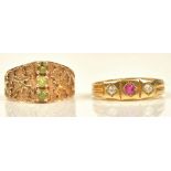 A Victorian 18ct gold ring, mounted with a cushion shaped ruby between two cushion shaped diamonds,
