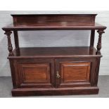 JAS Shoolbred & Co; a mahogany buffet with two open tiers over pair of panelled cupboards,